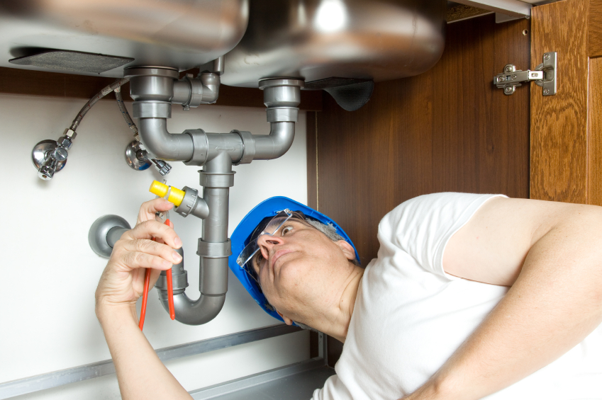 plumber doing a faucet repair