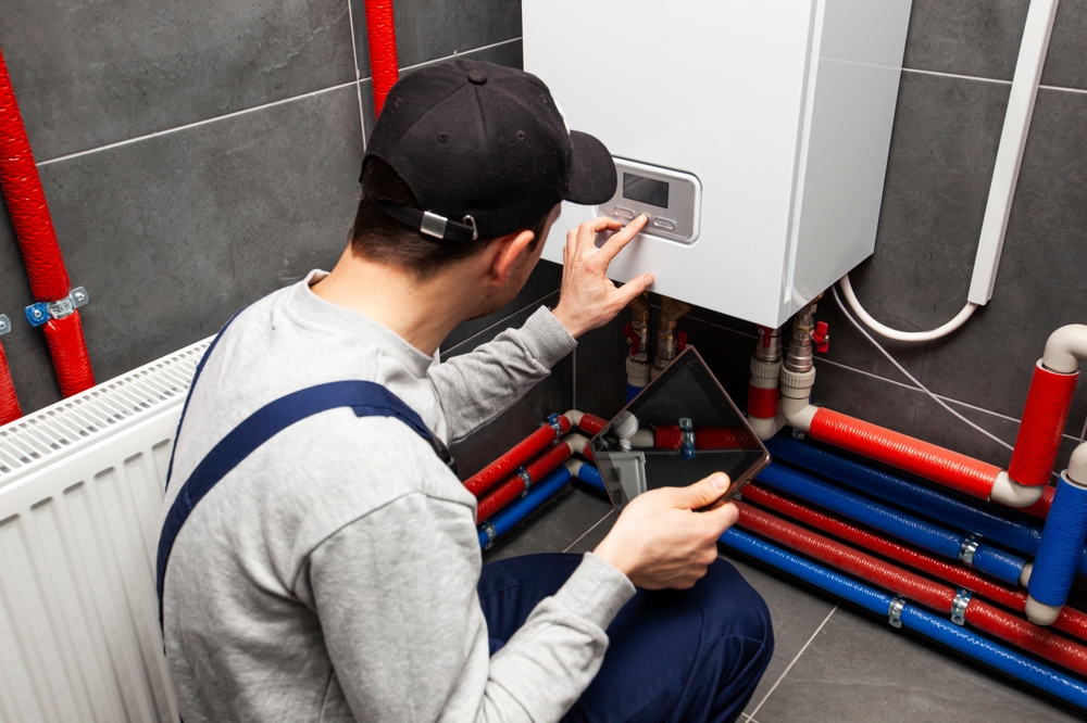 plumber installing a tankless water heater
